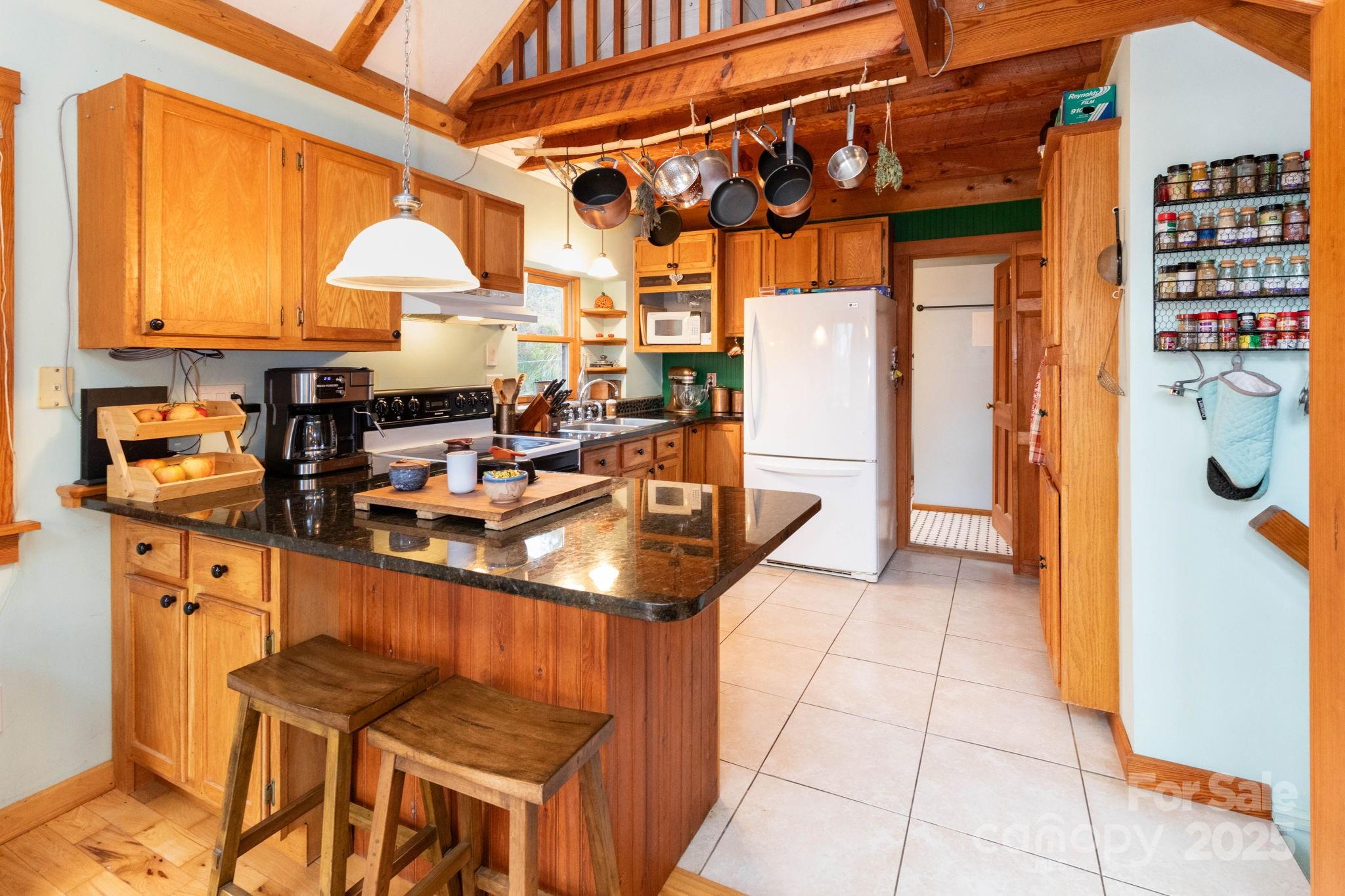 35 Norton Br Road Marshall, NC 28753 - Photo 11 of 35 a kitchen with stainless steel appliances granite countertop a stove and a refrigerator