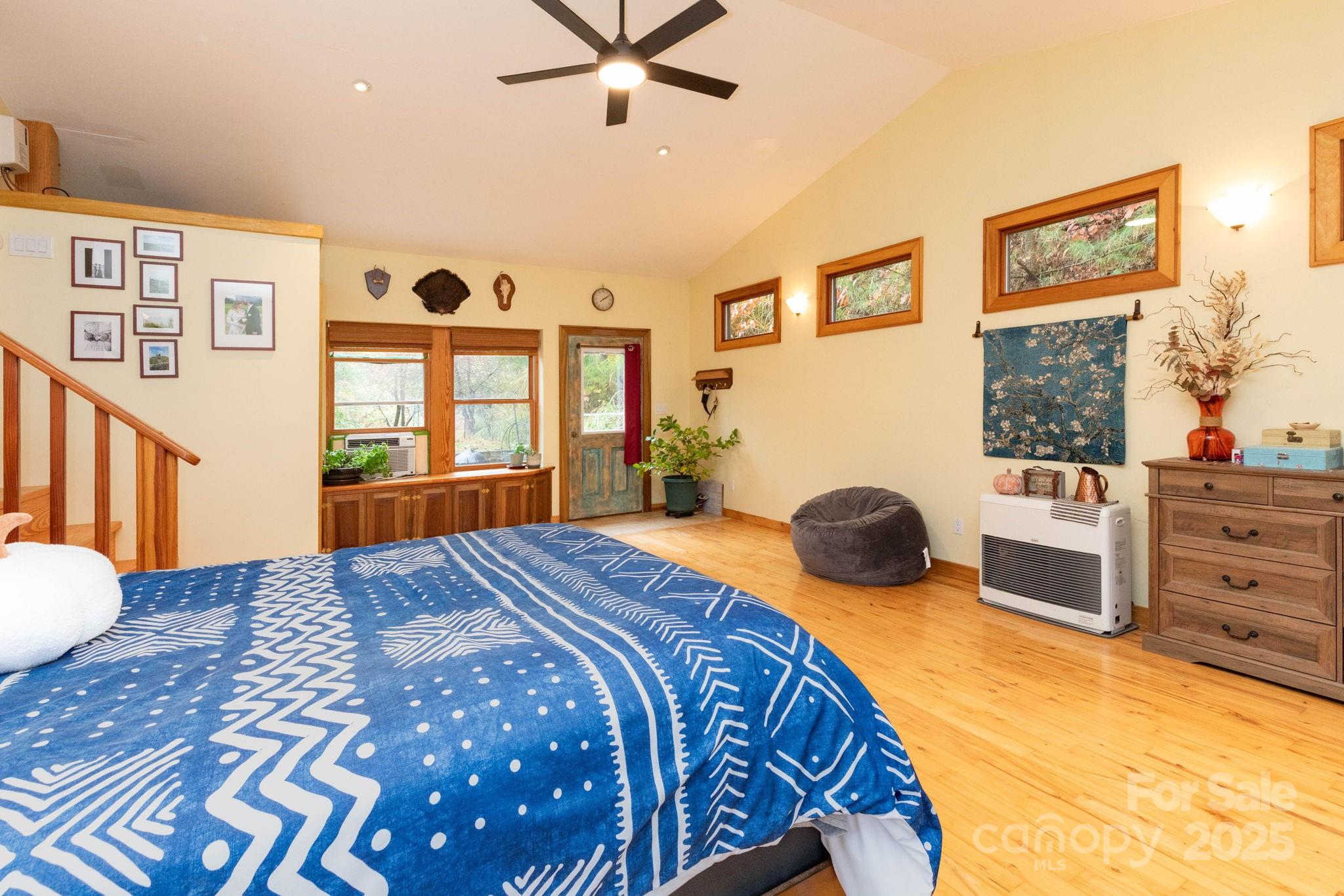 35 Norton Br Road Marshall, NC 28753 - Photo 18 of 35 a bedroom with a bed and wooden floor