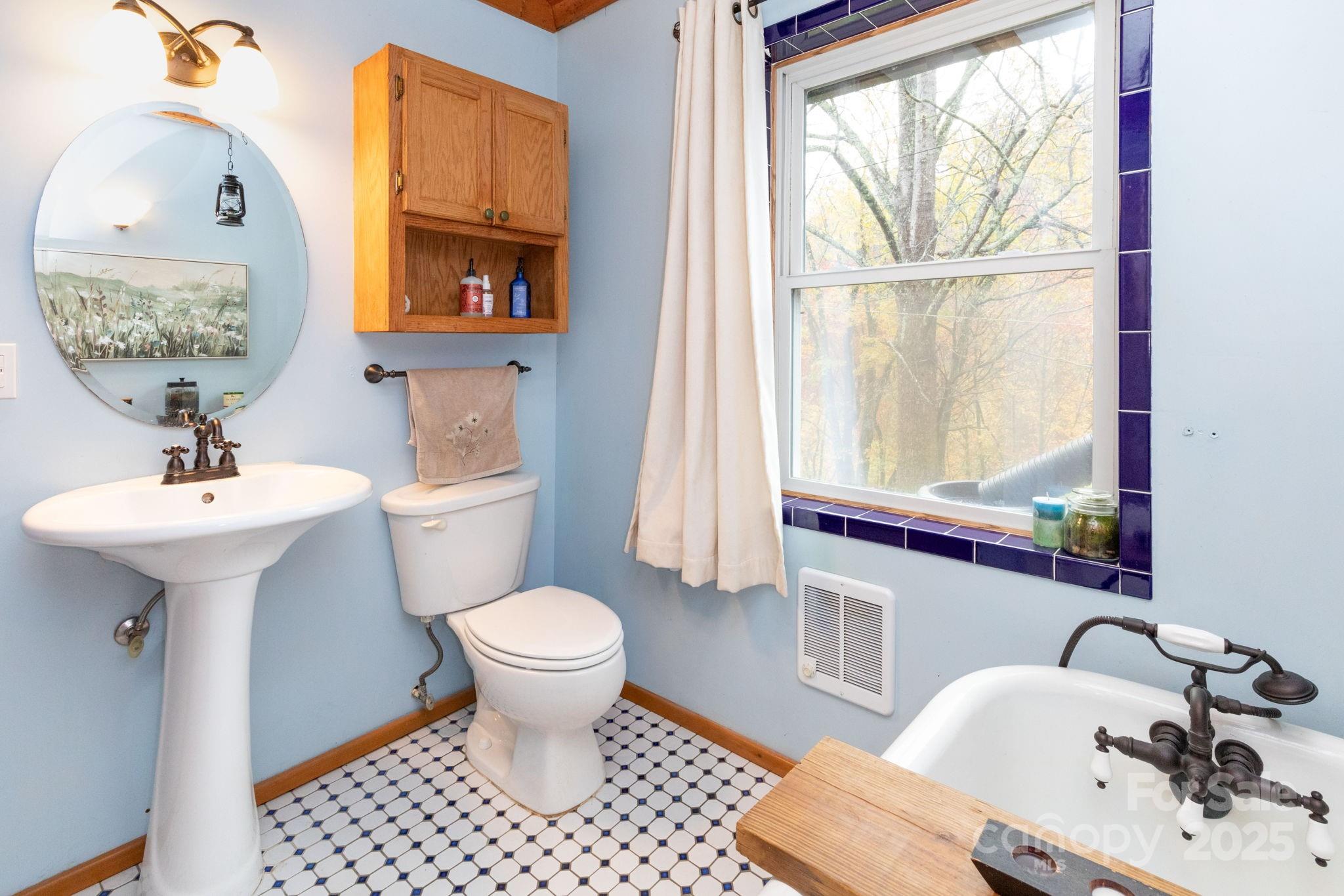 35 Norton Br Road Marshall, NC 28753 - Photo 19 of 35 a bathroom with a sink toilet and a mirror