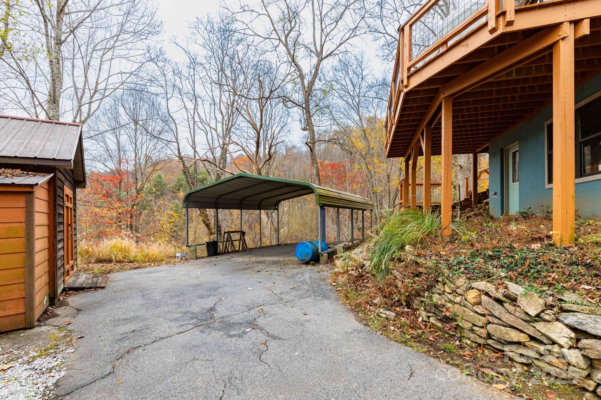 35 Norton Br Road Marshall, NC 28753 - Photo 29 of 35 a view of a house with a small yard and wooden fence