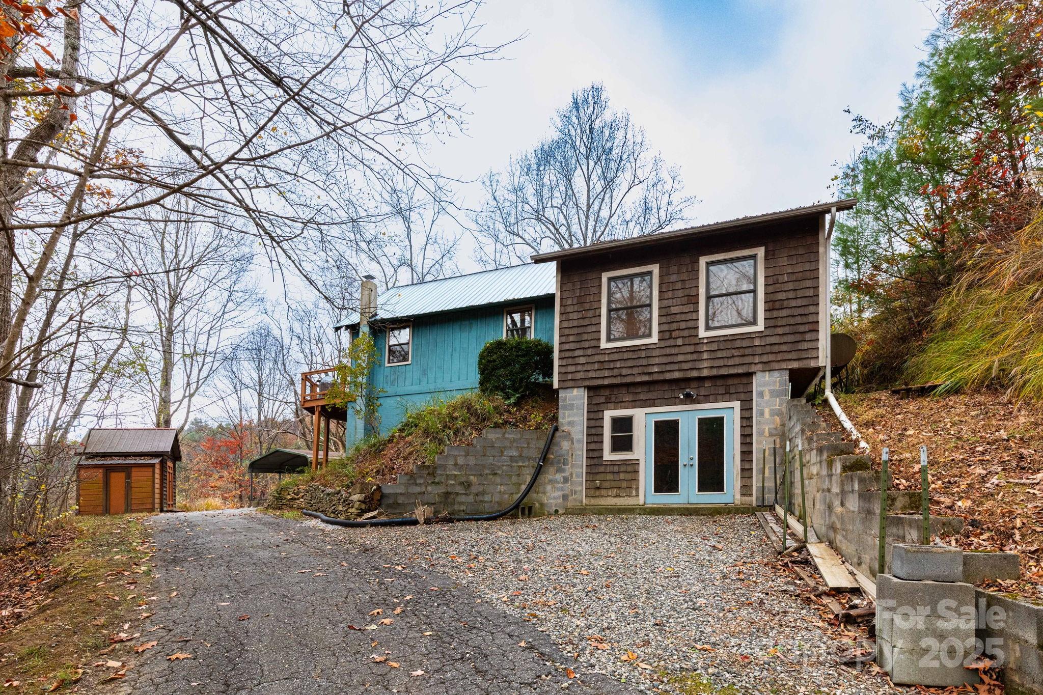 35 Norton Br Road Marshall, NC 28753 - Photo 4 of 35 a front view of a house with a yard and garage