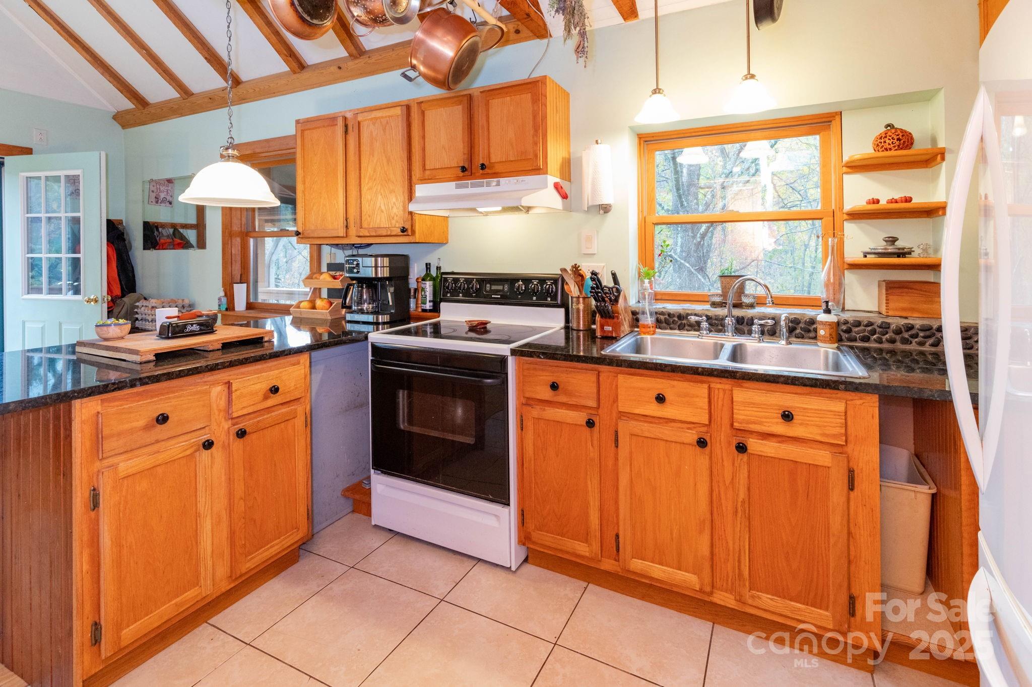 35 Norton Br Road Marshall, NC 28753 - Photo 10 of 35 a kitchen with stainless steel appliances granite countertop a sink stove and cabinets