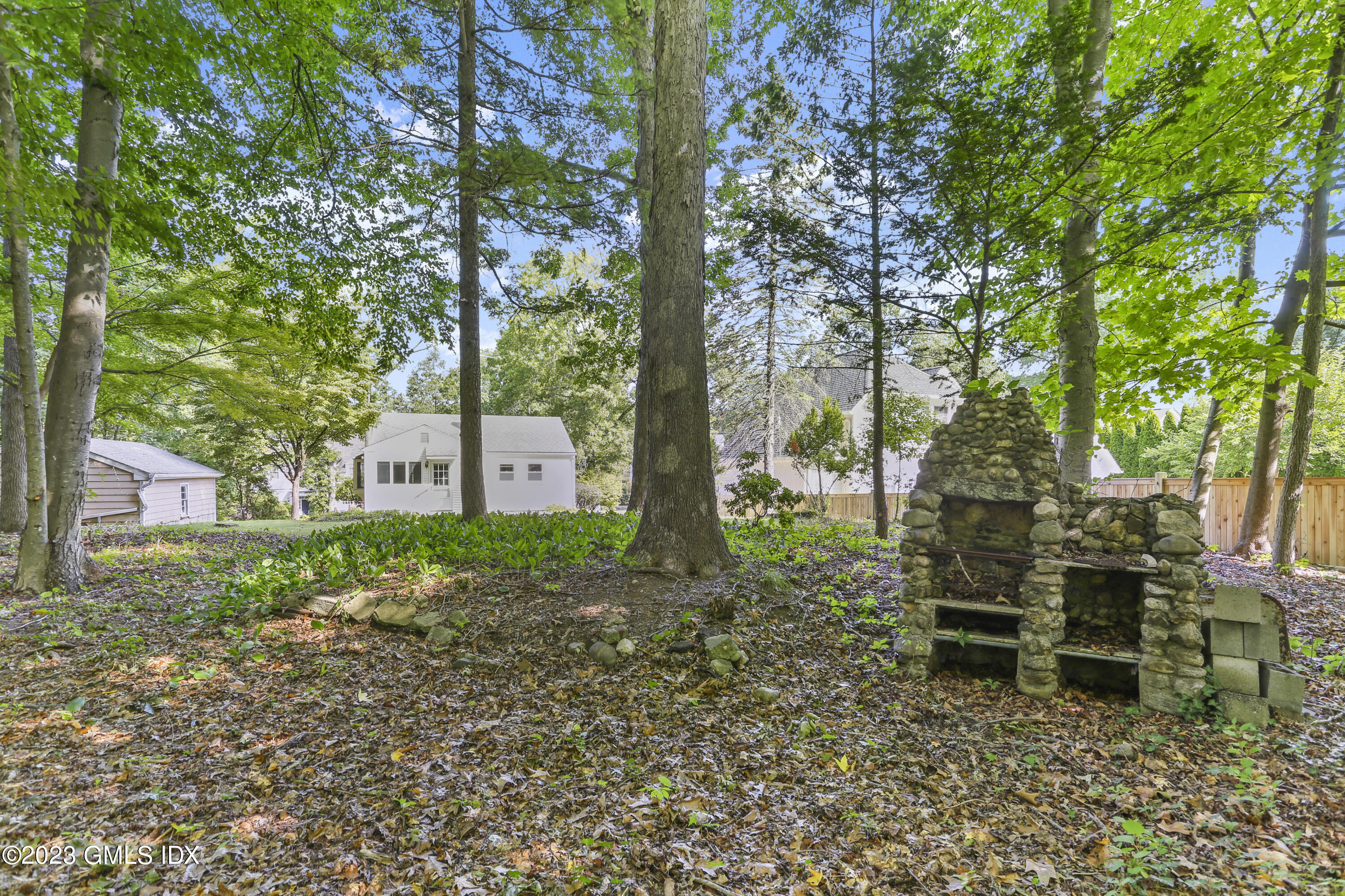 a backyard of a house with outdoor seating