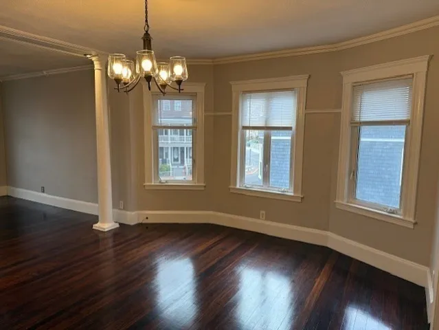 a view of livingroom with window and wooden floor