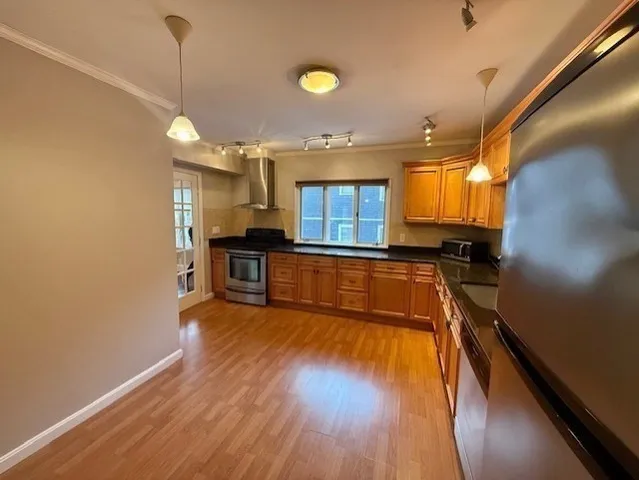 a view of a kitchen with a sink and a window