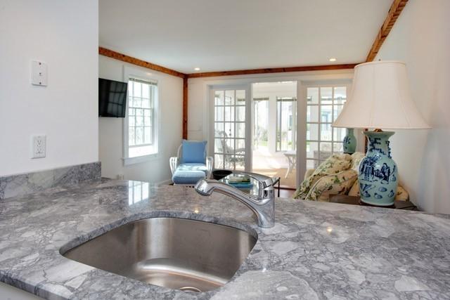 21 Milestone Way Mashpee, MA 02649 - Photo 11 of 27 a view of kitchen with granite countertop a sink and a window