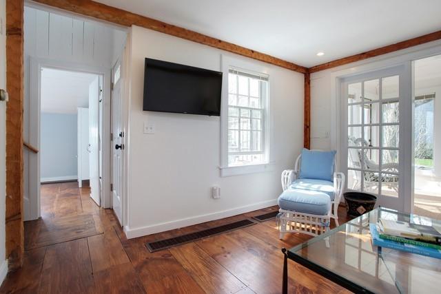 21 Milestone Way Mashpee, MA 02649 - Photo 12 of 27 a living room with furniture and a flat screen tv