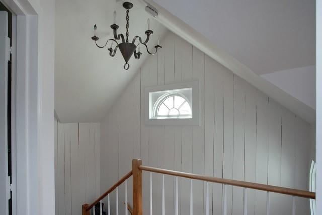 21 Milestone Way Mashpee, MA 02649 - Photo 16 of 27 a view of a hallway with window and chandelier
