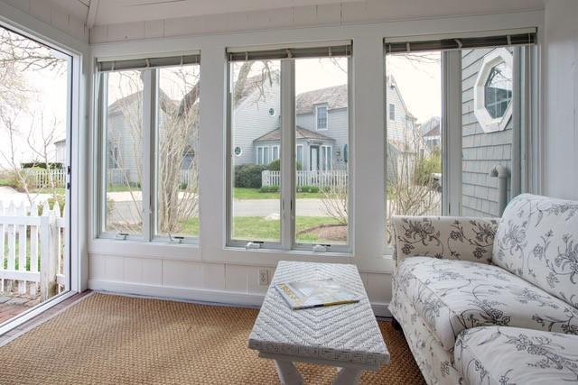 21 Milestone Way Mashpee, MA 02649 - Photo 6 of 27 a living room with furniture and a large window