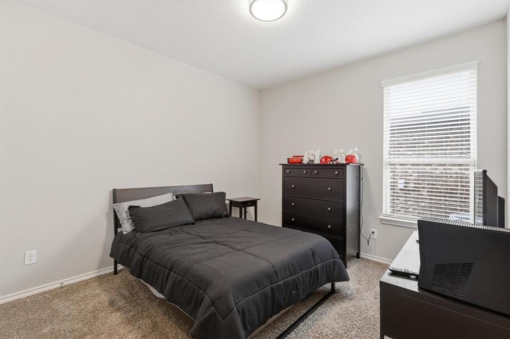 11500 Starlight Ranch Fort Worth, TX 76052 - Photo 24 of 40 This room features a window with blinds, light-colored walls, and carpeted flooring