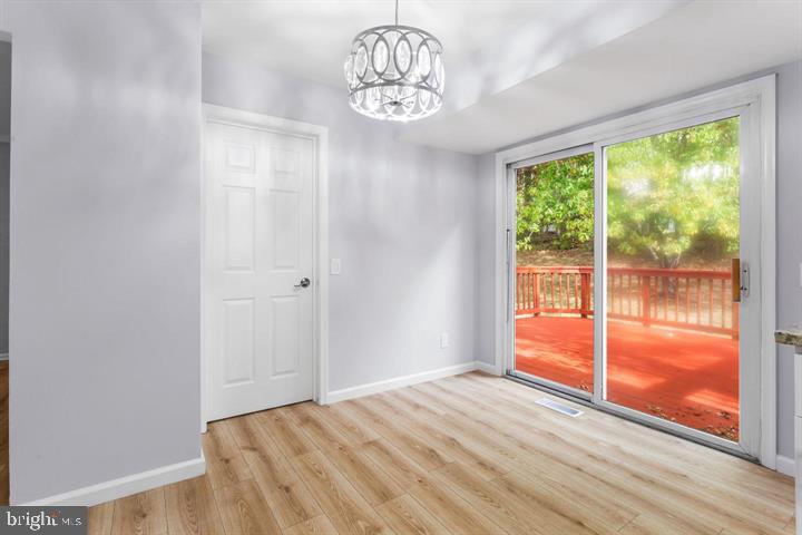 2807 Falling Brook Terrace Hyattsville, MD 20783 - Photo 14 of 48 a view of empty room with wooden floor and fan