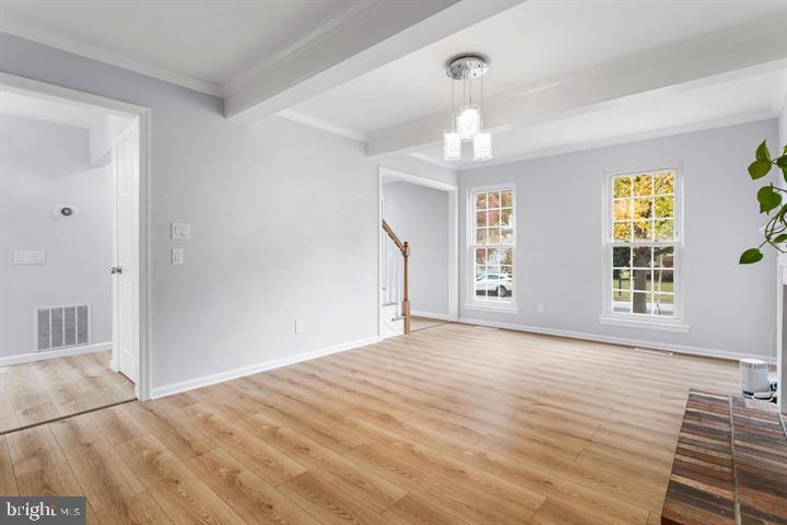2807 Falling Brook Terrace Hyattsville, MD 20783 - Photo 19 of 48 a view of an empty room with wooden floor and a window