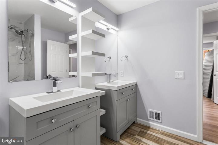 2807 Falling Brook Terrace Hyattsville, MD 20783 - Photo 24 of 48 a bathroom with a sink and a mirror