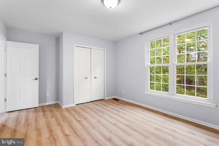2807 Falling Brook Terrace Hyattsville, MD 20783 - Photo 29 of 48 a view of empty room with wooden floor and fan