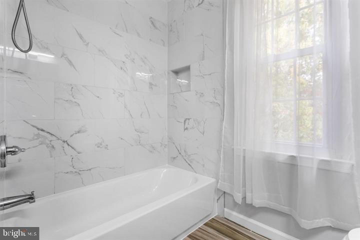 2807 Falling Brook Terrace Hyattsville, MD 20783 - Photo 30 of 48 a bathroom with a bathtub and shower