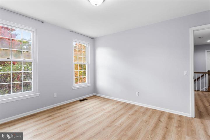 2807 Falling Brook Terrace Hyattsville, MD 20783 - Photo 33 of 48 a view of empty room with wooden floor and fan