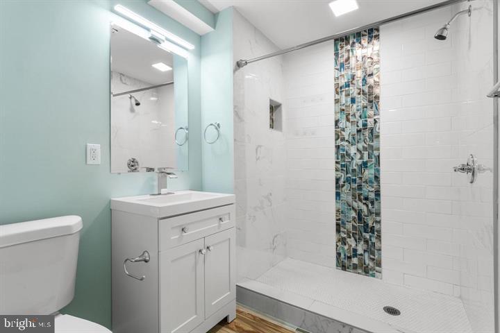 2807 Falling Brook Terrace Hyattsville, MD 20783 - Photo 38 of 48 a bathroom with a sink toilet and shower
