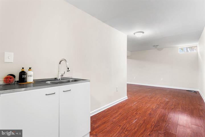 2807 Falling Brook Terrace Hyattsville, MD 20783 - Photo 39 of 48 a kitchen with a sink and a mirror