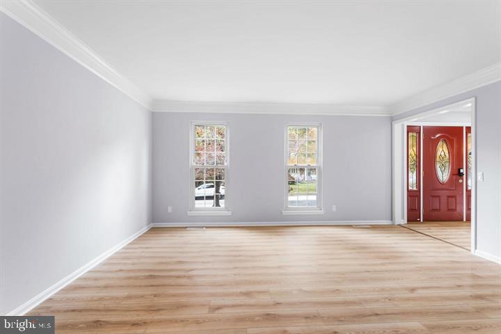 2807 Falling Brook Terrace Hyattsville, MD 20783 - Photo 4 of 48 an empty room with wooden floor and windows