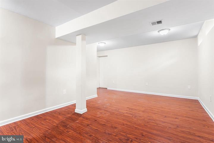2807 Falling Brook Terrace Hyattsville, MD 20783 - Photo 41 of 48 a view of an empty room with wooden floor