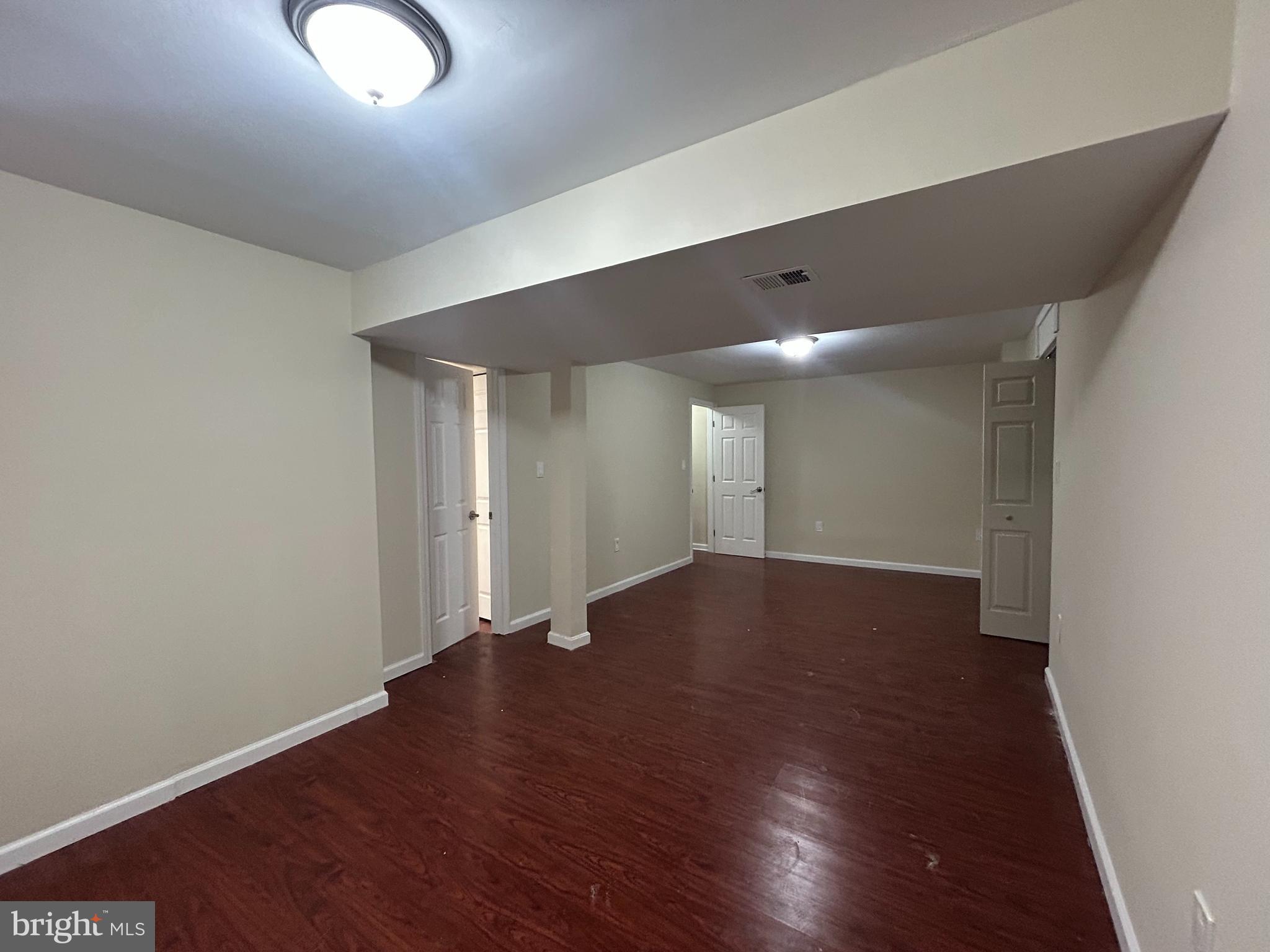 2807 Falling Brook Terrace Hyattsville, MD 20783 - Photo 42 of 48 a view of an empty room with wooden floor