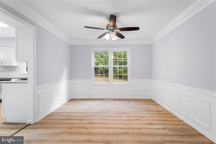 2807 Falling Brook Terrace Hyattsville, MD 20783 - Photo 7 of 48 a view of empty room with wooden floor and fan