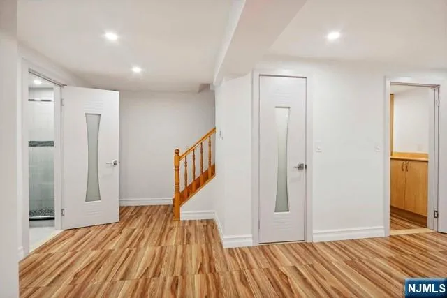 a view of a room with wooden floor and stairs