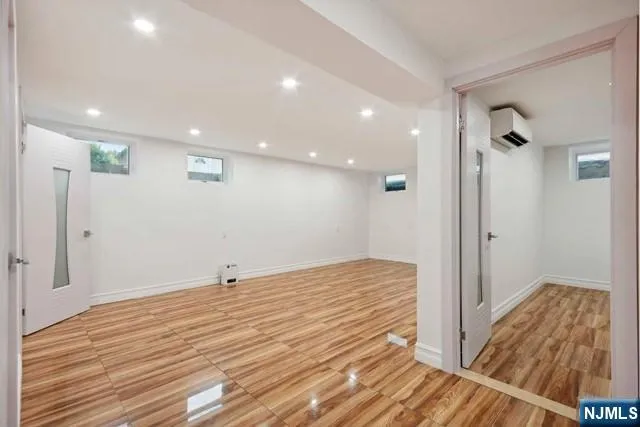 a view of hallway with wooden floor