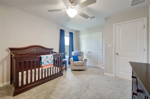 a bedroom with furniture and balcony