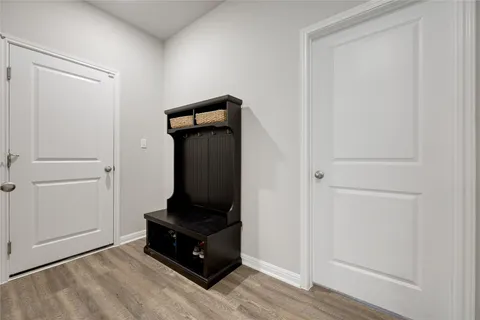 a living room with a bed and a mirror