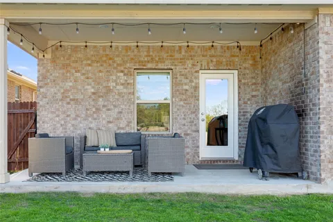 a view of a patio in back of a house