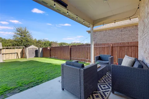 a view of a patio with couches chairs and a table and chairs