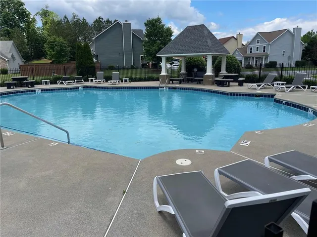 a view of a house with a small yard and plants