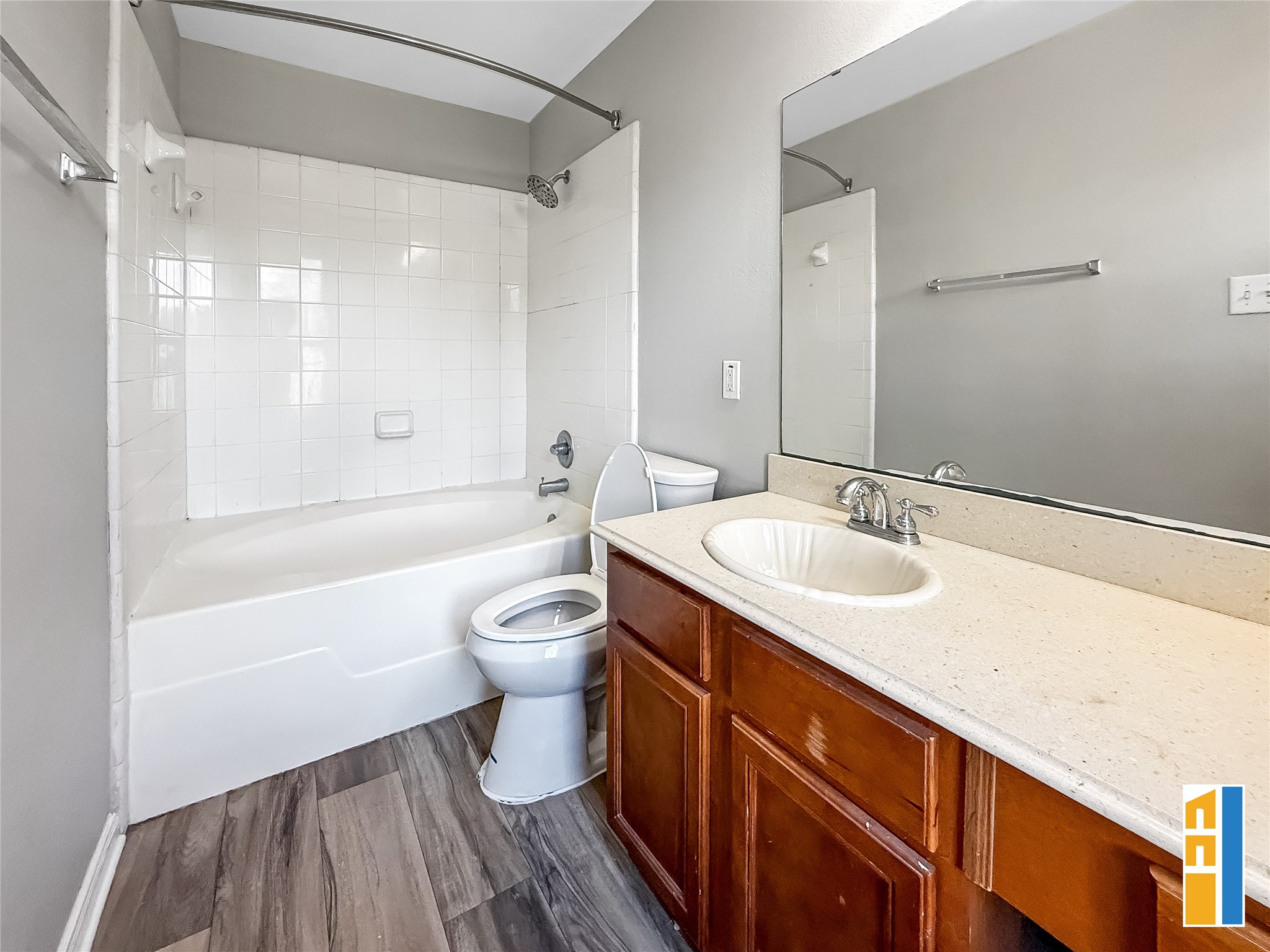 29566 North Legends Bend Drive Spring, TX 77386 - Photo 16 of 21 Experience modern comfort in the primary bathroom, featuring sleek flooring, a spacious vanity, and a pristine tub-shower combination.