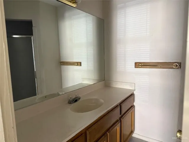 a bathroom with a toilet and a window