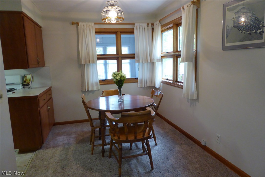 10316 Johnnycake Ridge Road Painesville, OH 44077 - Photo 3 of 30 Dining Room Adjacent to Kitchen - Note the Corner Windows!