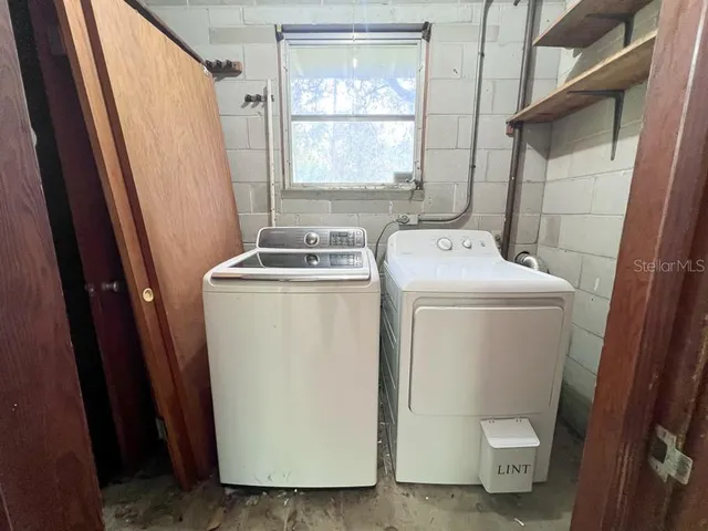 a utility room with dryer and washer