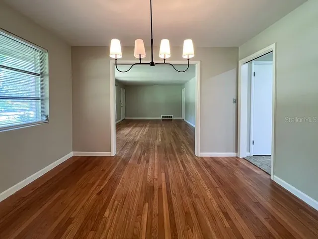 a view of a livingroom with wooden floor