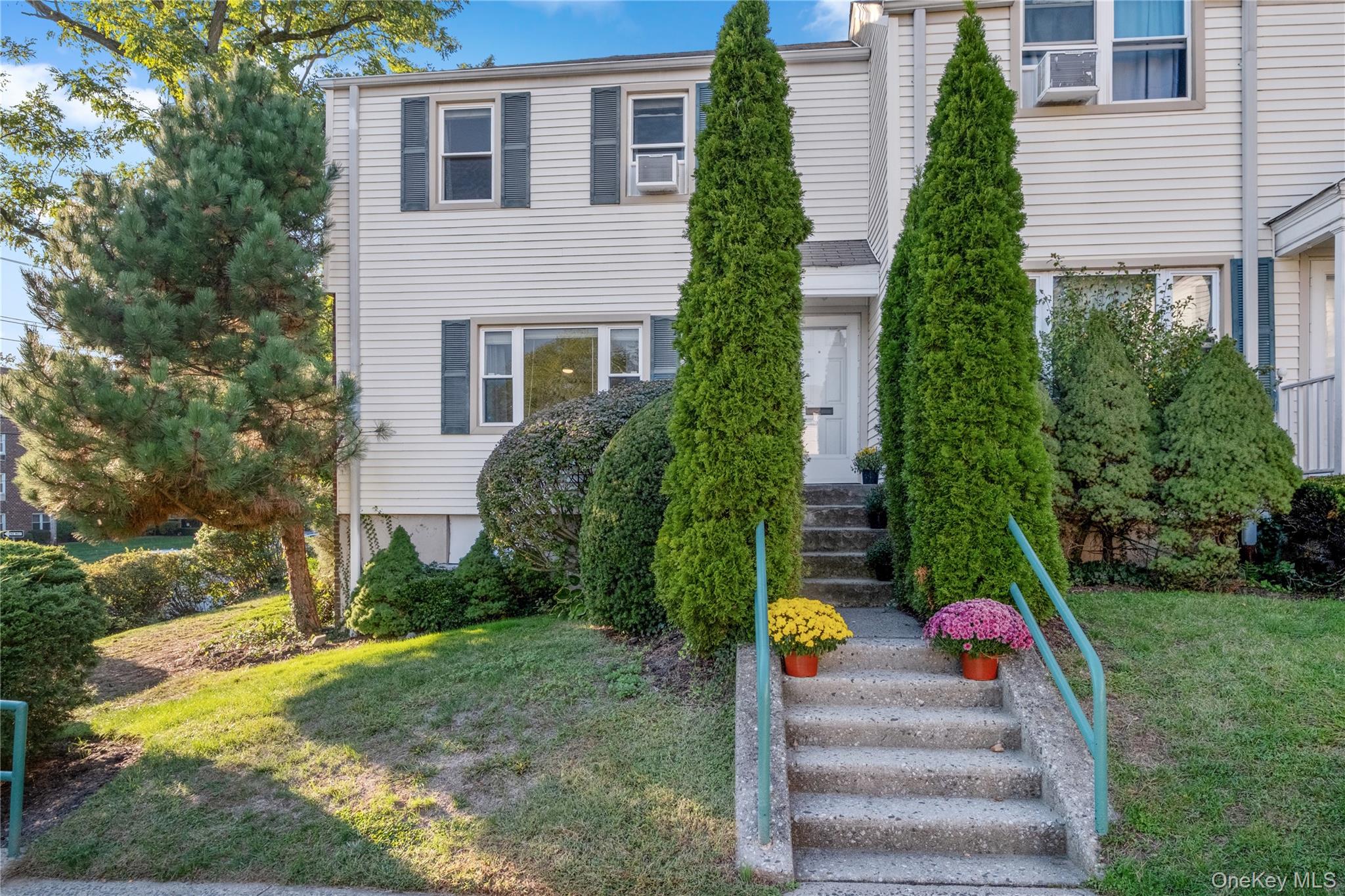 737 Tuckahoe Road, Unit 22 Yonkers, NY 10710 - Photo 1 of 1 a view of a house with backyard and garden