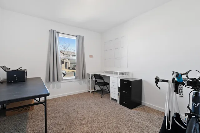 a view of a workspace with furniture