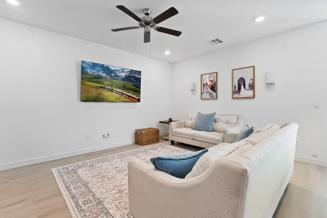 a living room with furniture and a rug