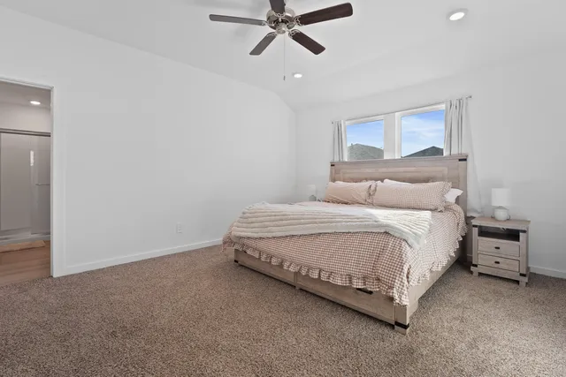 a bedroom with a bed and window