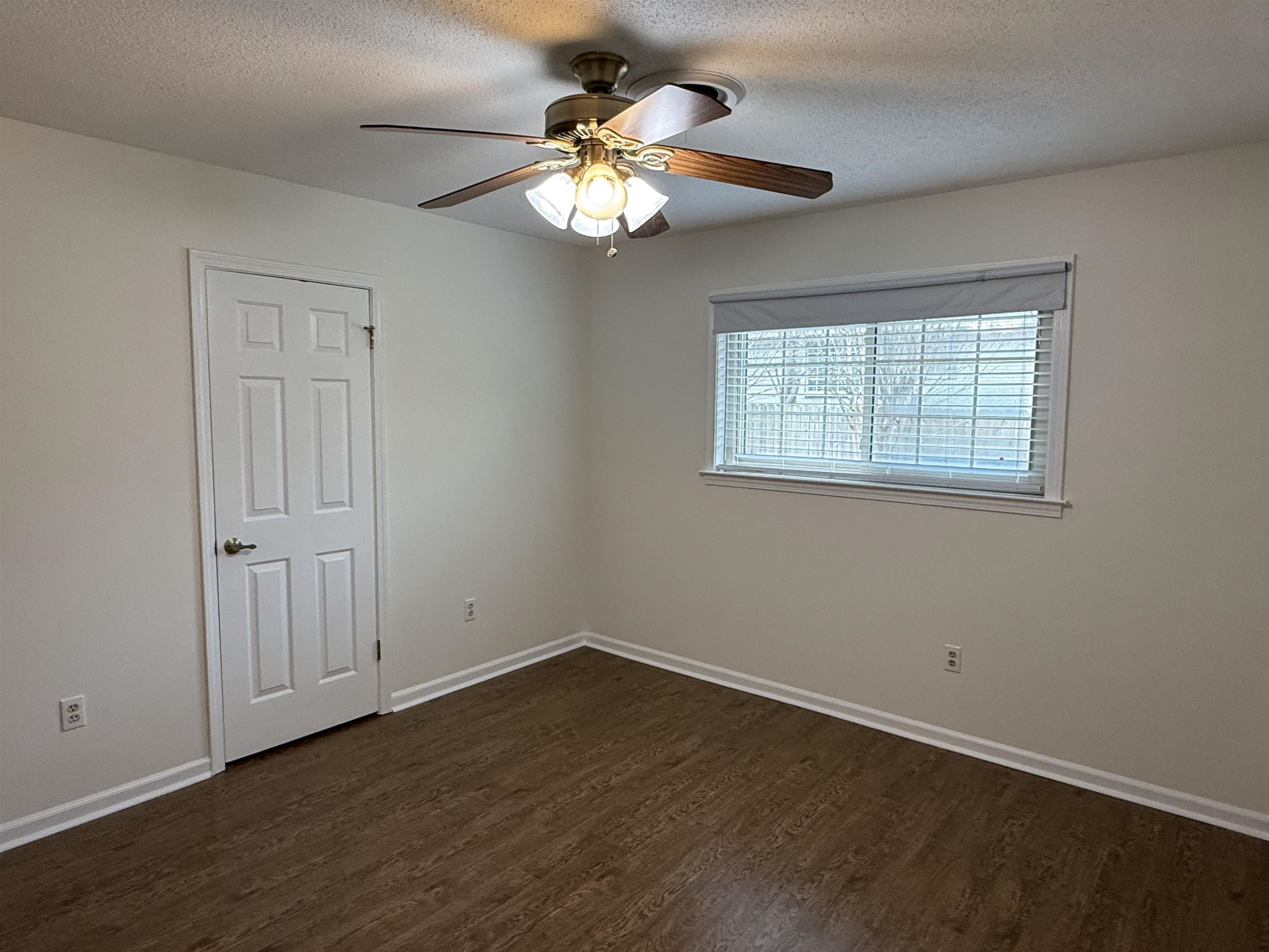 2639 Cedar Ridge Drive Germantown, TN 38138 - Photo 12 of 17 wooden floor in an empty room with a window