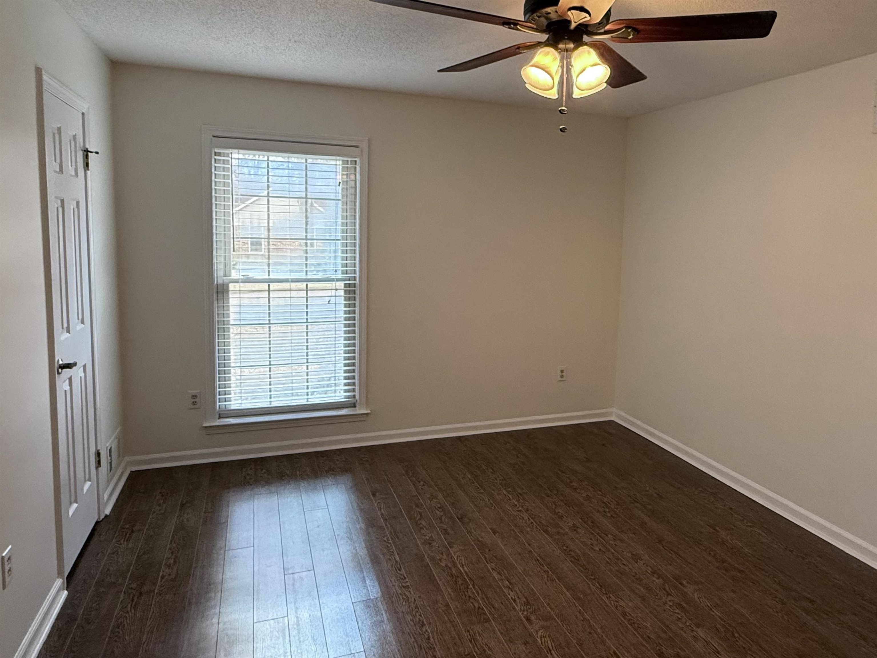 2639 Cedar Ridge Drive Germantown, TN 38138 - Photo 14 of 17 an empty room with wooden floor fan and windows