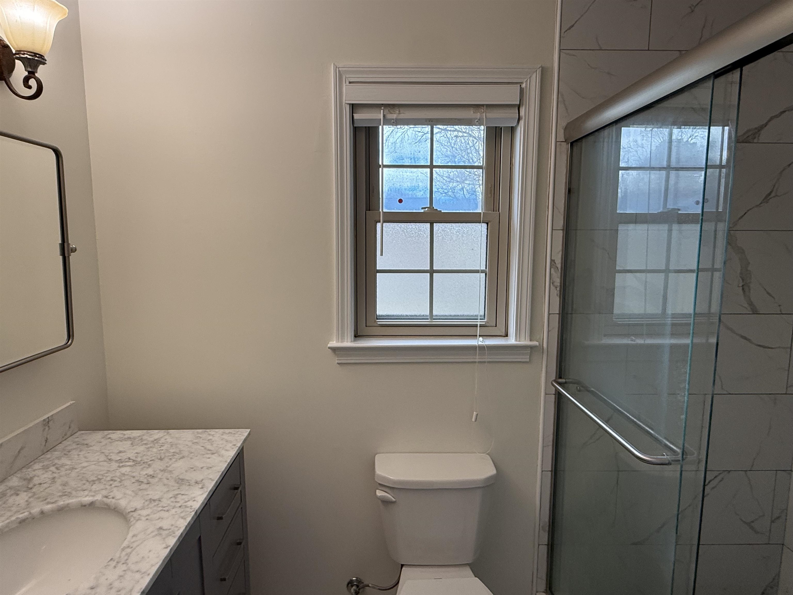 2639 Cedar Ridge Drive Germantown, TN 38138 - Photo 15 of 17 a bathroom with a granite countertop sink toilet and shower