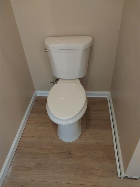 4820 Westbourne Drive Powder Springs, GA 30127 - Photo 16 of 16 a bathroom with a toilet and a rug