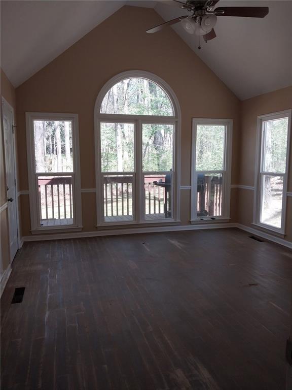 4820 Westbourne Drive Powder Springs, GA 30127 - Photo 3 of 16 an empty room with a fireplace and windows