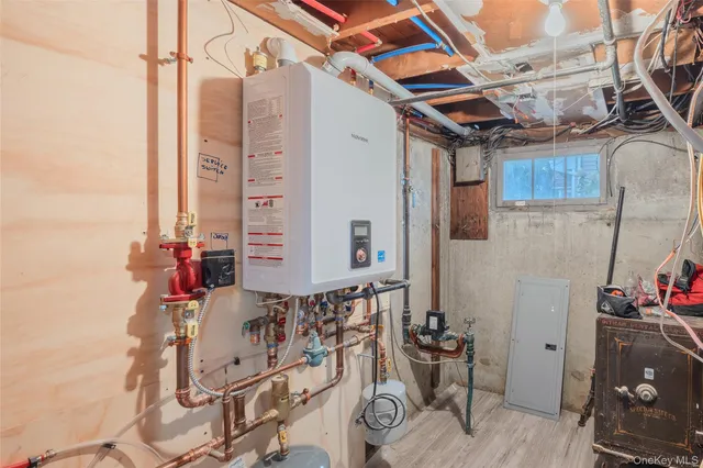 a bathroom with a toilet sink and a mirror