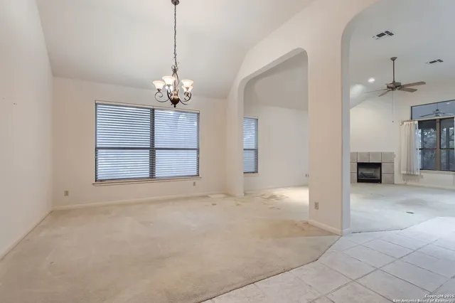 a view of a kitchen with a sink and a chandelier