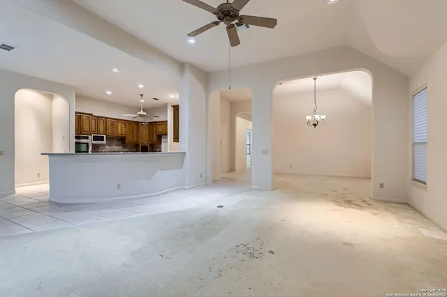 a view of a kitchen with a sink and a refrigerator